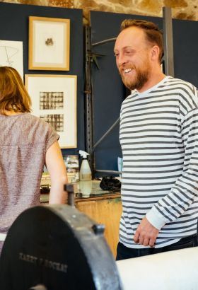 Man and a woman in a printing studio